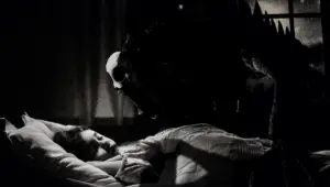 Girl having sleep paralysis with a demon on her bed